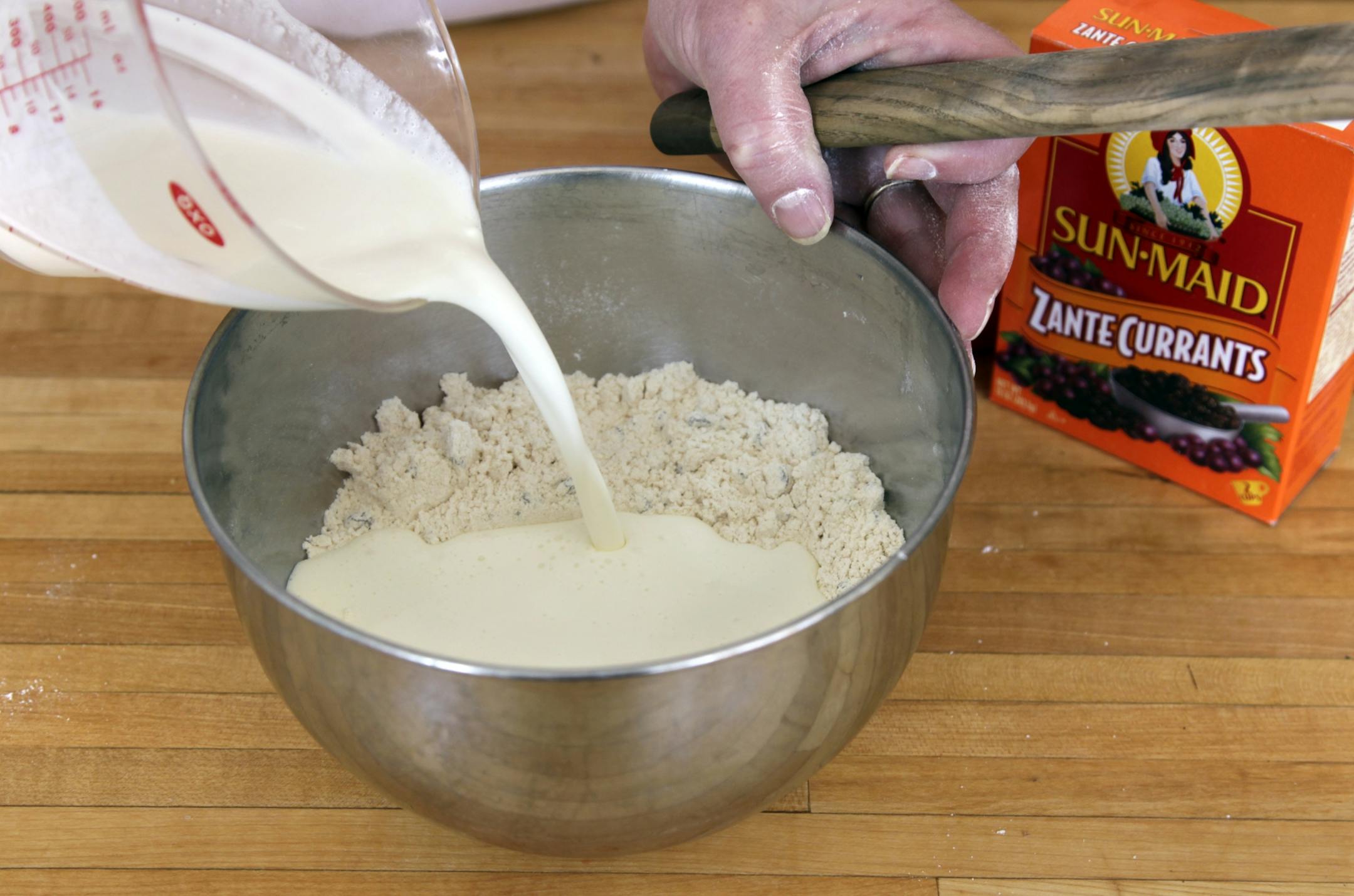 Cream is added to well-whisked dry ingredients.