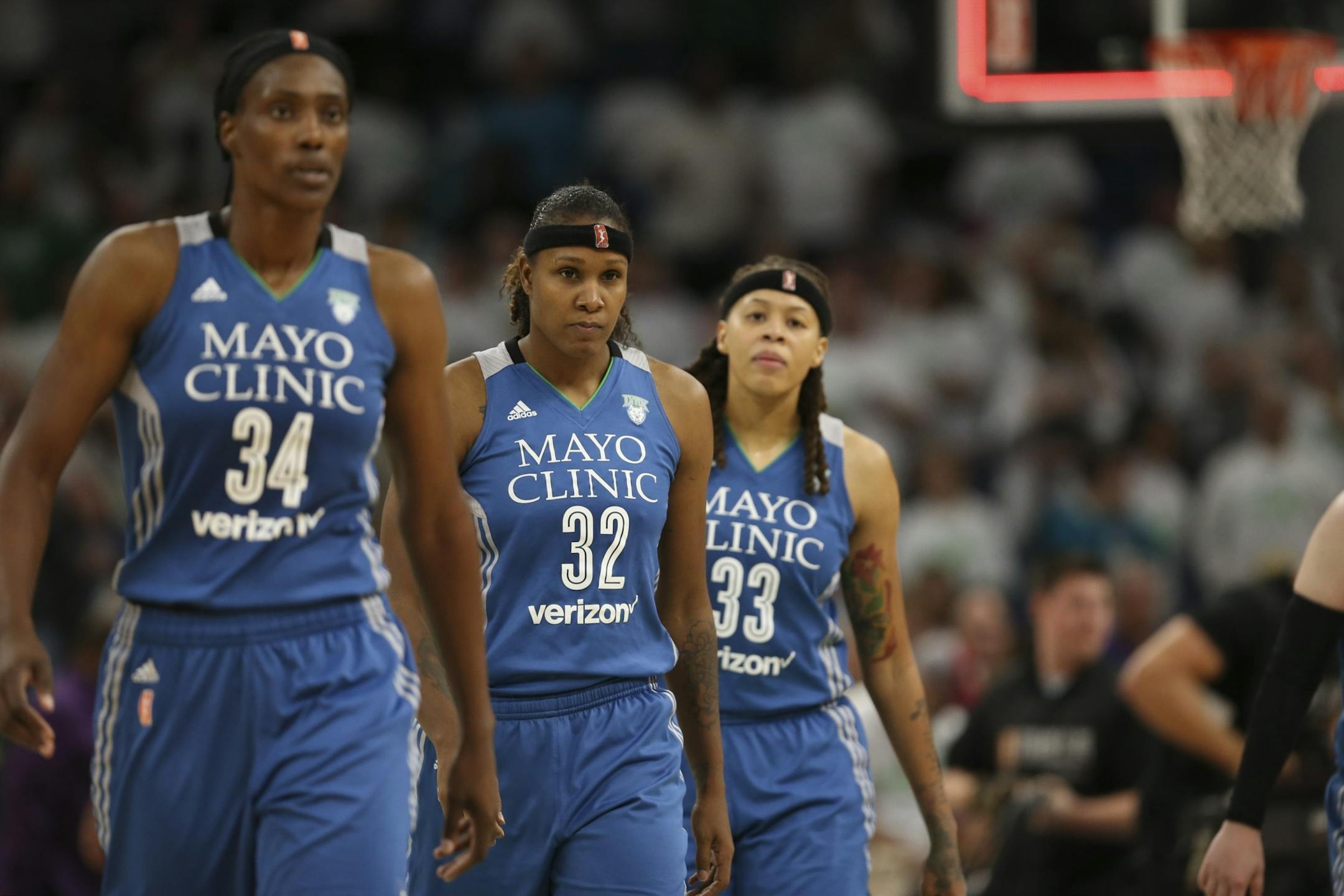 Minnesota Lynx center Sylvia Fowles (34), forward Rebekkah Brunson (32), and guard Seimone Augustus (33) walked towards the bench after the team's loss.