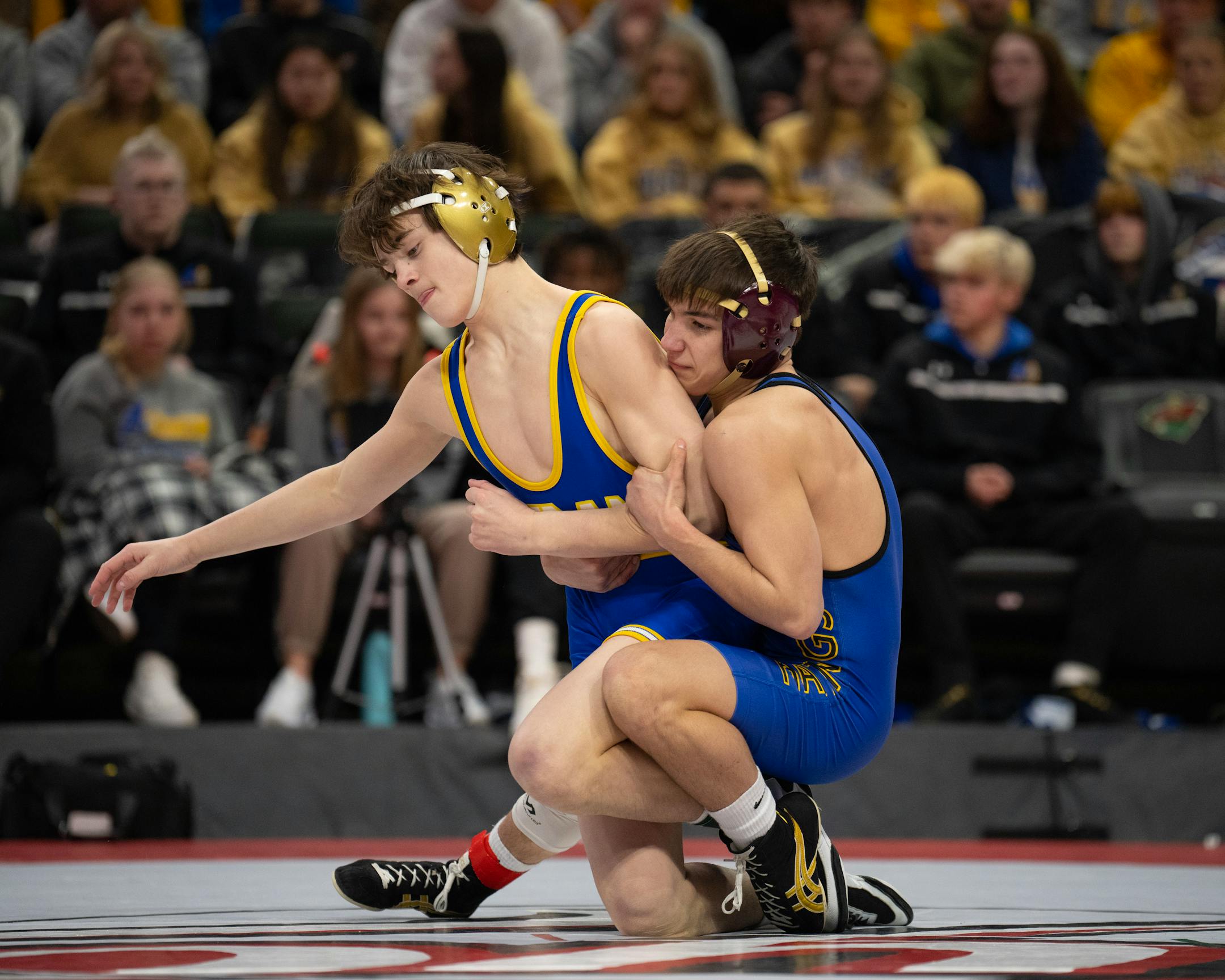 Blake Beissel of Hastings, right, on his way to a 3-0 decision over Chase Mills of St. Michael-Albertville in their 113 lb. match.