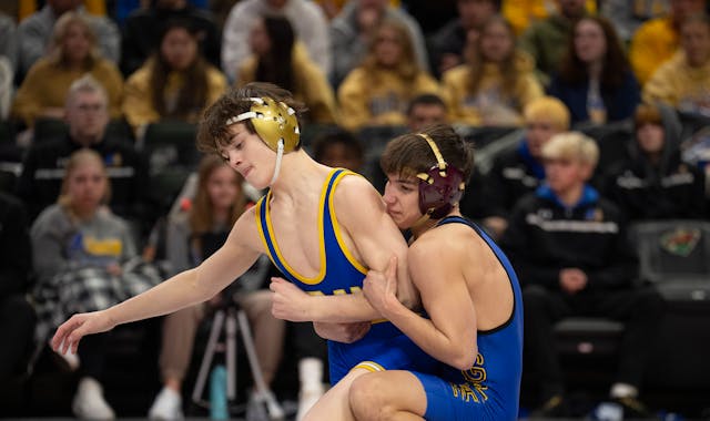 Blake Beissel of Hastings, right, on his way to a 3-0 decision over Chase Mills of St. Michael-Albertville in their 113 lb. match.