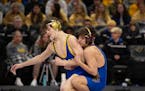 Blake Beissel of Hastings, right, on his way to a 3-0 decision over Chase Mills of St. Michael-Albertville in their 113 lb. match.