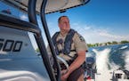 Hennepin County Sheriff's Deputy Jeremy Gunia on patrol on Lake Minnetonka near Spring Park. He will be educating boaters on the new law requiring car