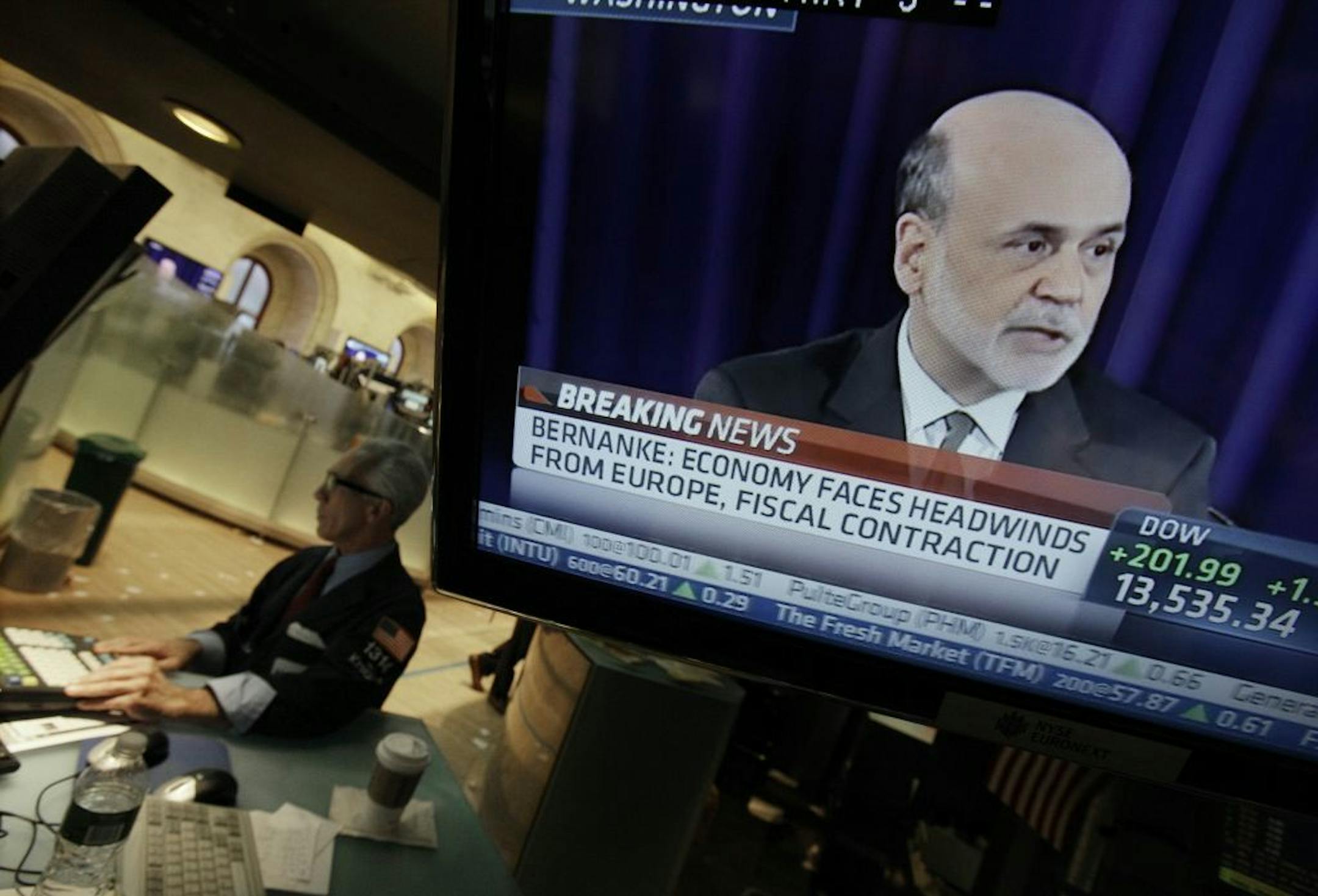 Specialist David Pologruto works at his post on the floor of the New York Stock Exchange, as Federal Reserve Chairman Ben Bernanke holds a news conference in Washington, Thursday, Sept. 13, 2012. Bernanke said the Federal Reserve does not have a specific economic target for its new U.S. stimulus program and will keep buying bonds until it sees more jobs, lower unemployment and stronger growth.