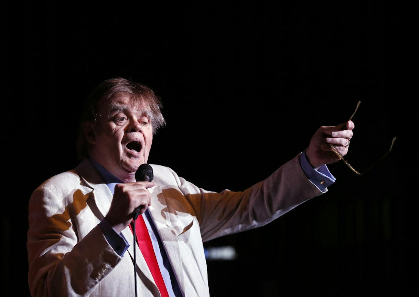 Garrison Keillor sings with the audience during the encore. ] (Leila Navidi/Star Tribune) leila.navidi@startribune.com BACKGROUND INFORMATION: The live broadcast for "A Prairie Home Companion" at the State Theatre in Minneapolis on Saturday, May 21, 2016. This is Garrison Keillor's last season on "A Prairie Home Companion."