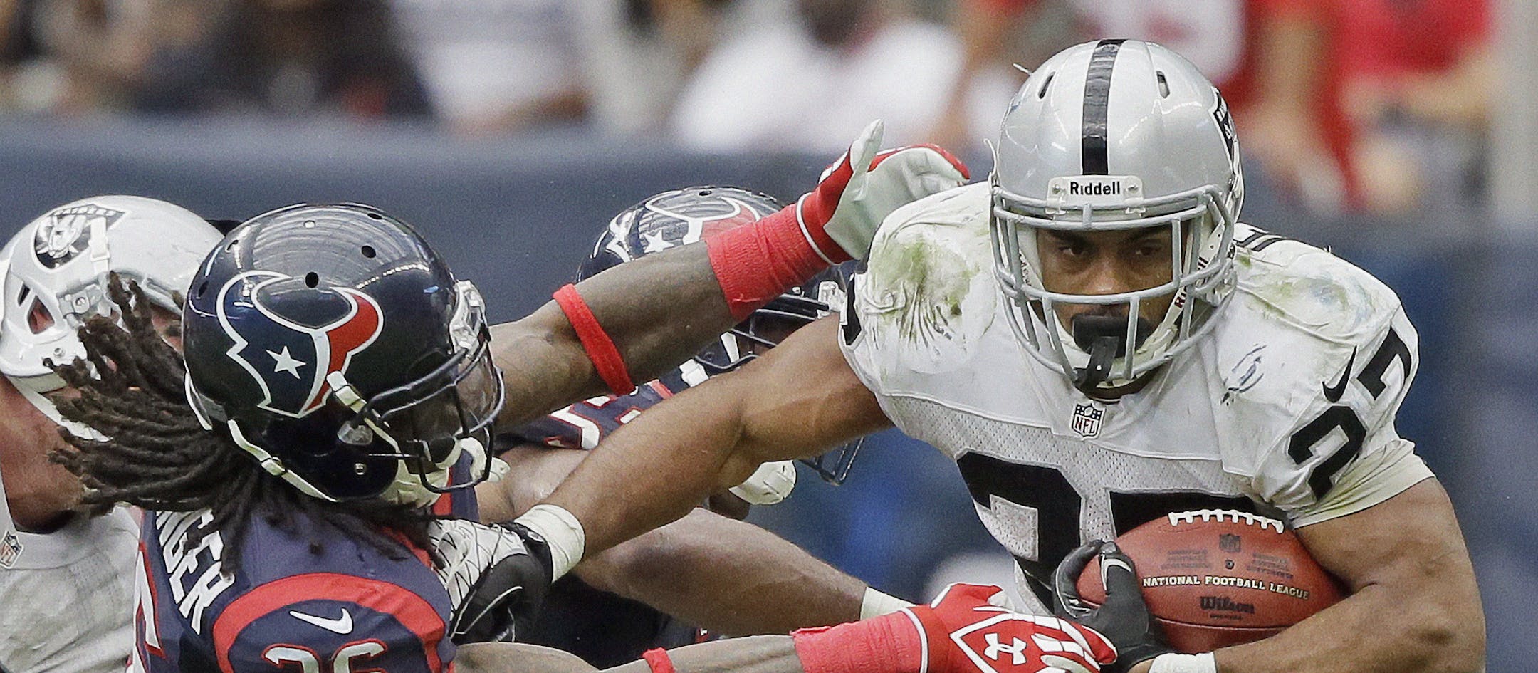 Oakland Raiders' Rashad Jennings breaks away from Houston Texans' D.J. Swearinger (36) for an 80-yard touchdown run during the second half of an NFL football game Sunday, Nov. 17, 2013, in Houston. (AP Photo/Tony Gutierrez)