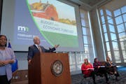 Gov. Tim Walz rected to the February budget forecast presented by, on the right, MMB Commissioner Erin Campbell, State Economist Dr. Laura Kalambokidi