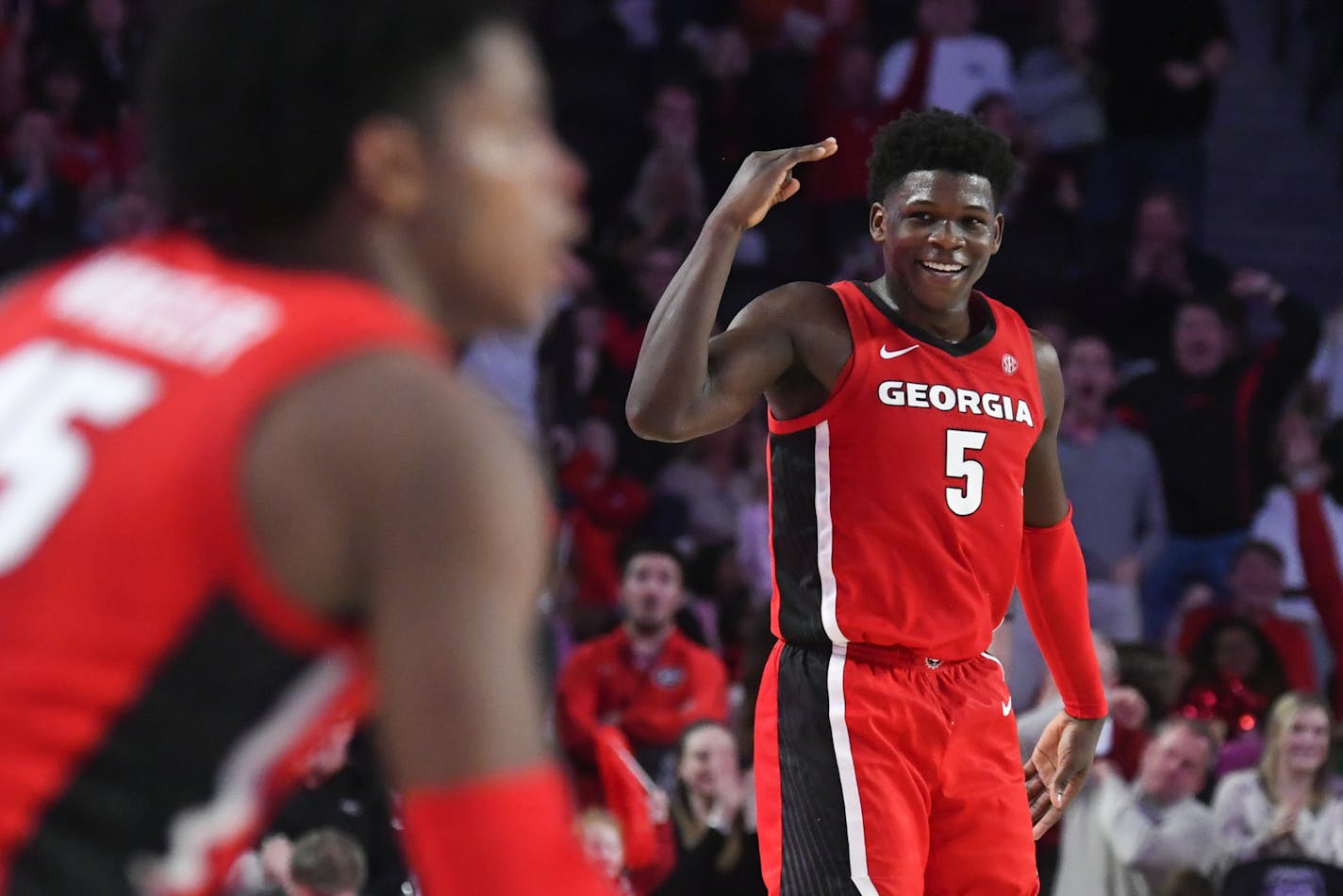 Georgia guard Anthony Edwards (5) celebrates a shot by guard Sahvir Wheeler, left, during the second half of an NCAA college basketball game Auburn, Wednesday, Feb. 19, 2020, in Athens, Ga. Georgia won 65-55. (AP Photo/John Amis) ORG XMIT: OTKJA110