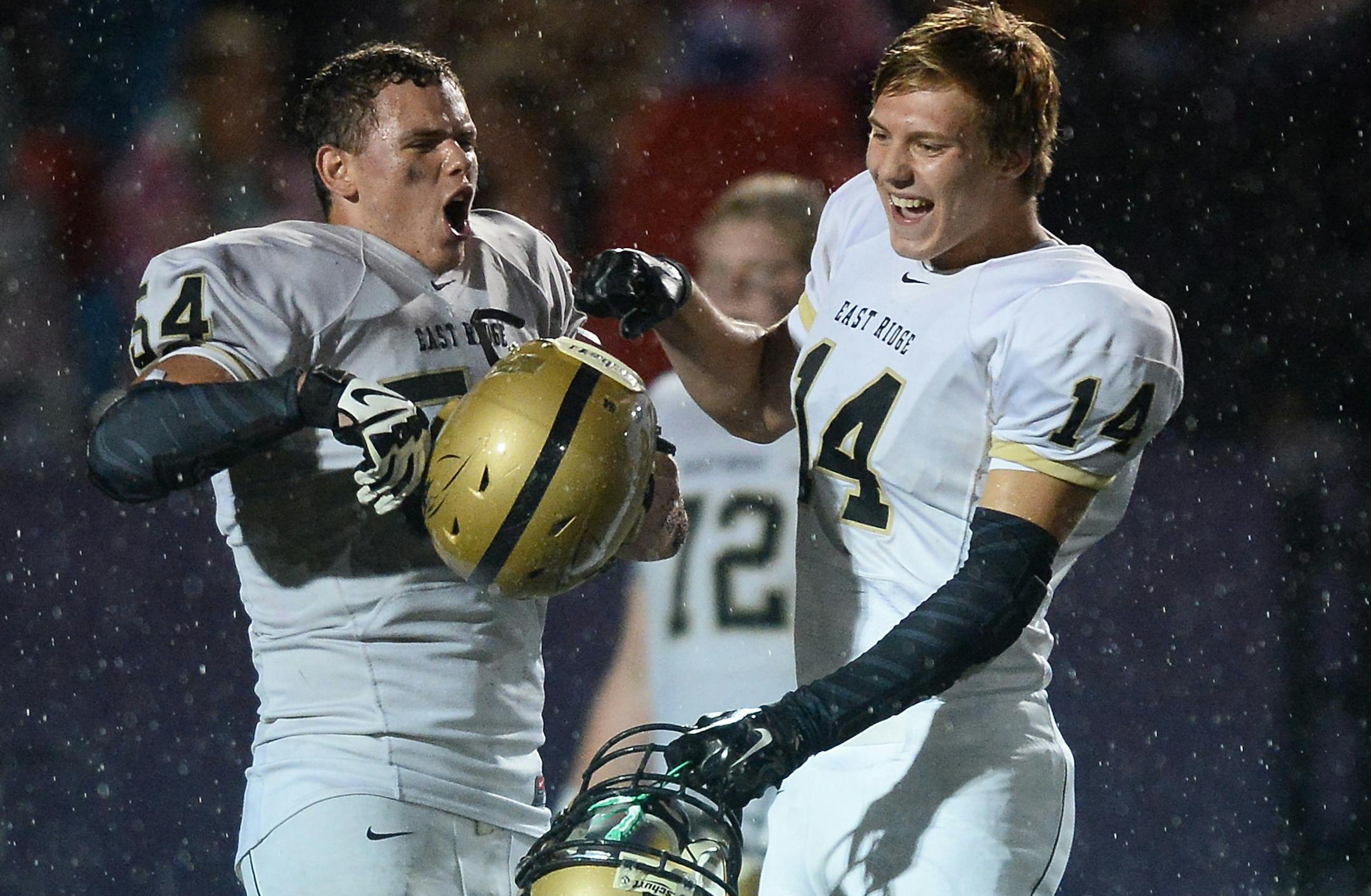 East Ridge lineman Brock Albrecht (54) and tight end Ben Arndt (14) celebrated their team's 35-20 victory over Cretin-Derham Hall Friday night. ] Aaron Lavinsky ï aaron.lavinsky@startribune.com East Ridge played Cretin-Derham Hall on Friday, Sept. 18, 2015 at the University of St. Thomas in St. Paul. ORG XMIT: MIN1509182140430388
