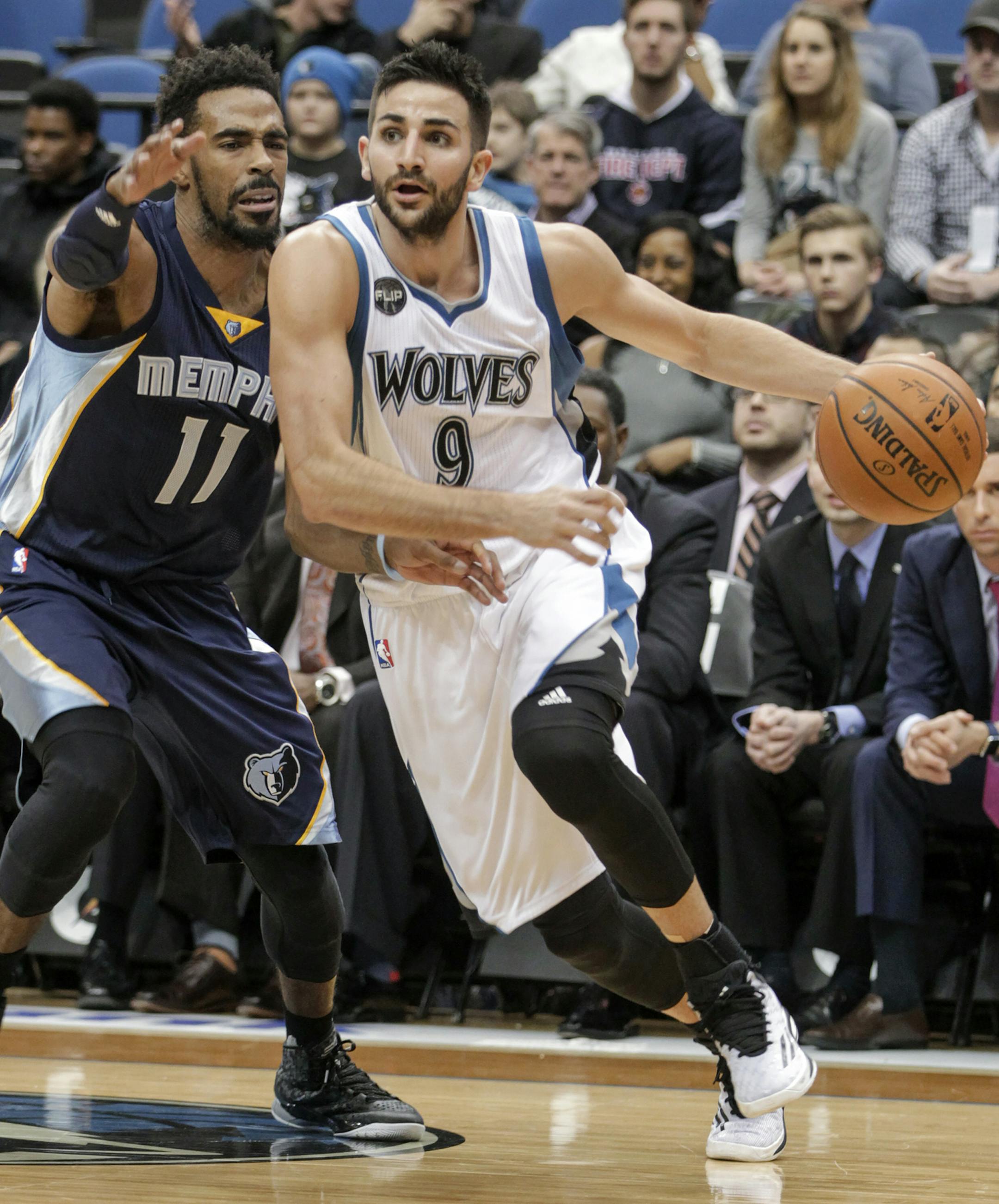 Minnesota Timberwolves guard Ricky Rubio (9) drives against Memphis Grizzlies guard Mike Conley (11) during the first half of an NBA basketball game Saturday, Jan. 23, 2016, in Minneapolis. Rubio had 15 points on the night as Minnesota won 106-101. (AP Photo/Paul Battaglia)