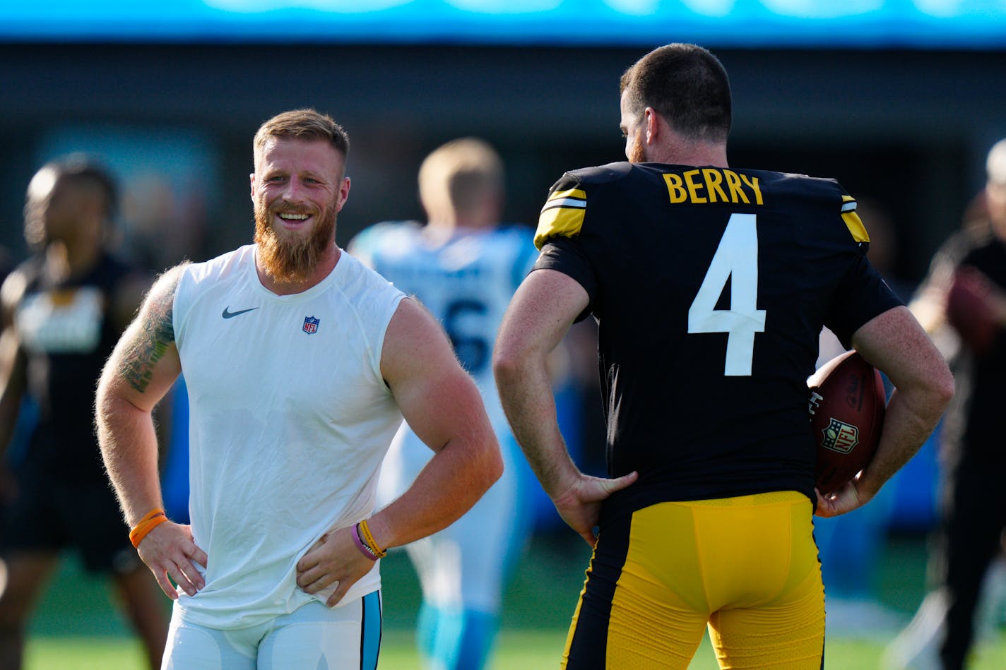 Carolina Panthers kicker Joey Slye, left, talks with Pittsburgh Steelers punter Jordan Berry before a preseason NFL football game Friday, Aug. 27, 2021, in Charlotte, N.C. (AP Photo/Jacob Kupferman)