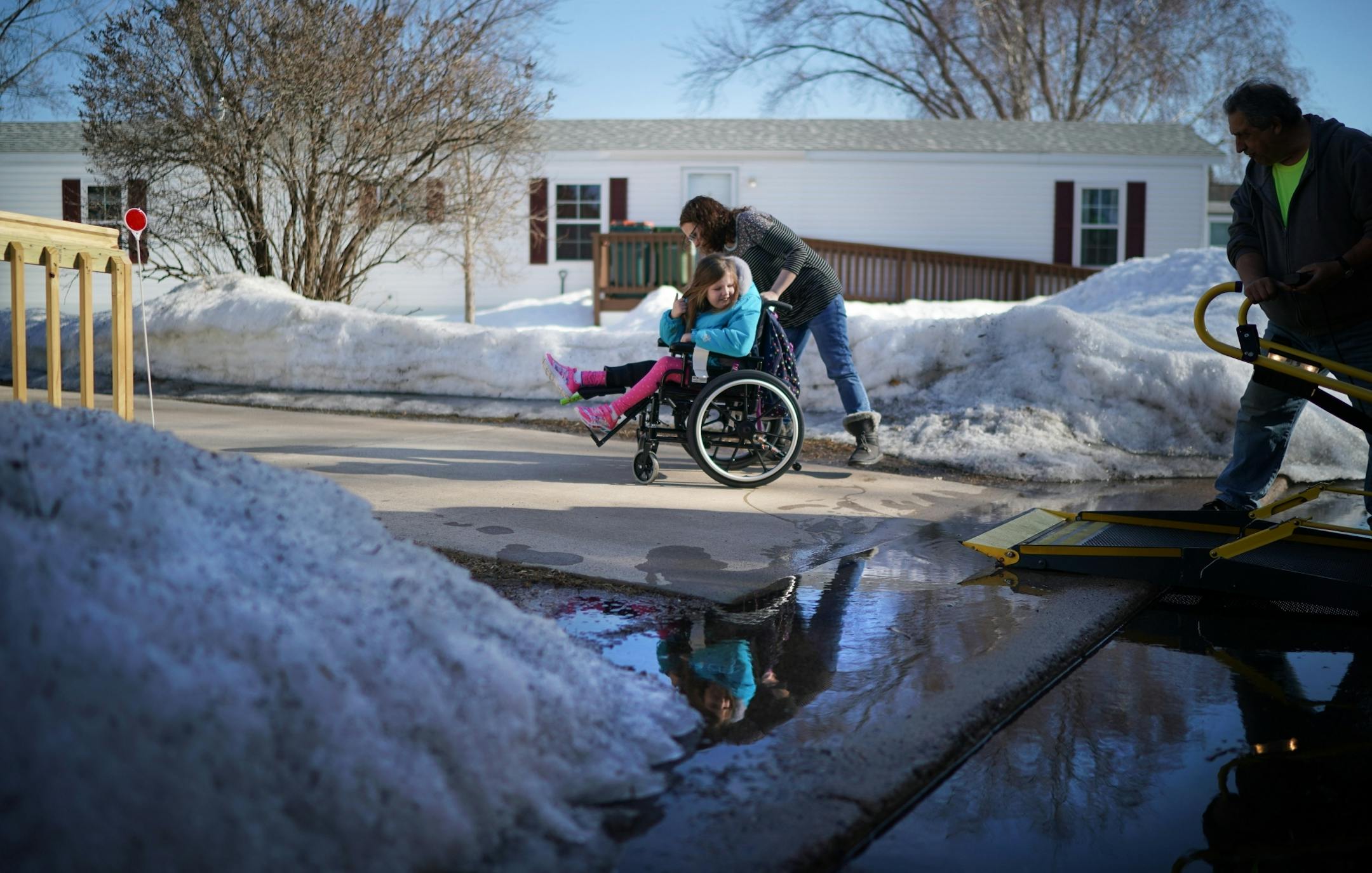 Linsey Rippy waited for her youngest daughter Sydney, 9, to get off the school bus after school. Sydney, 9, is a 3rd grader.