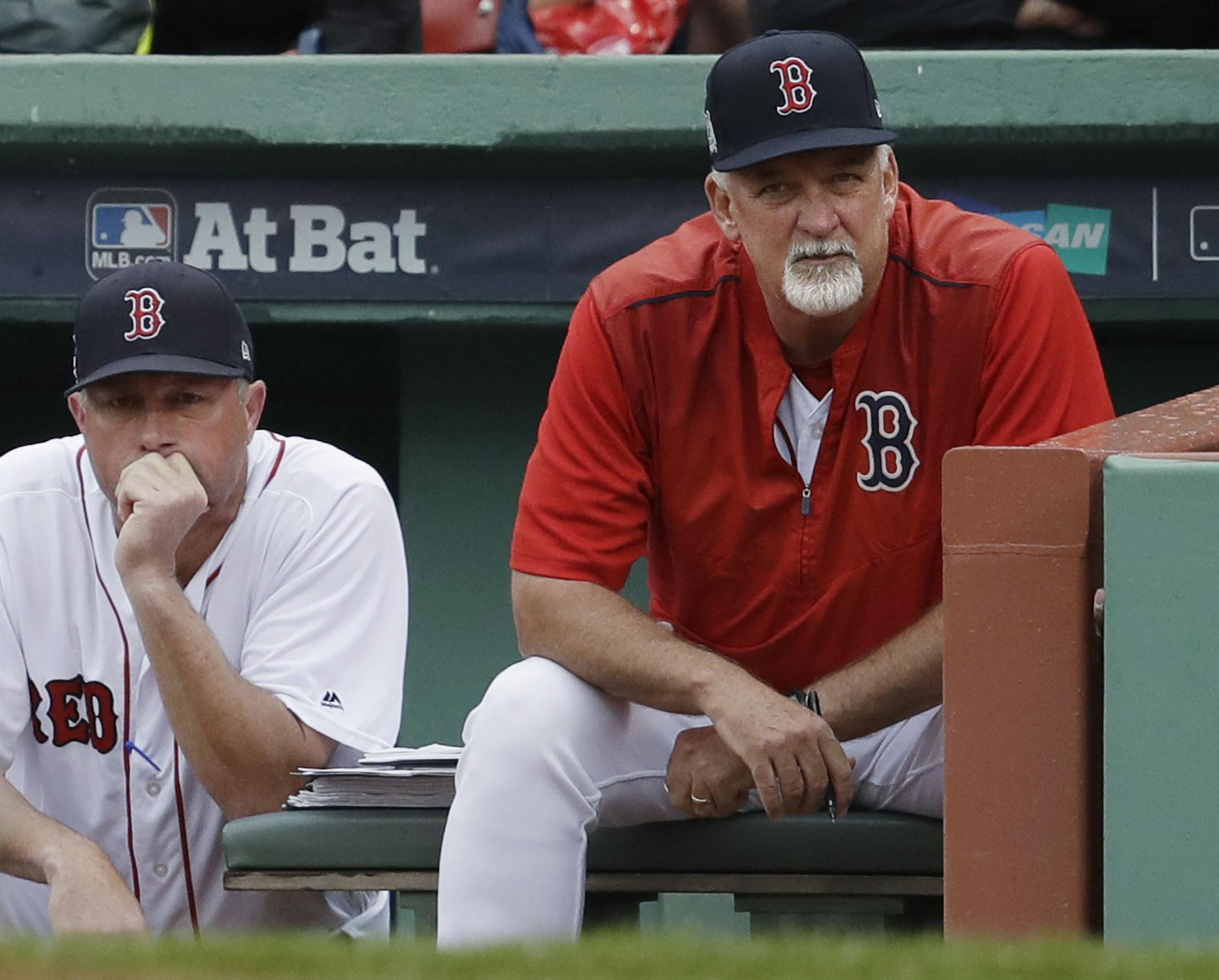 Boston Red Sox bench coach Gary Disarcina, left, and pitching coach Carl Willis watch from the dugout during the sixth inning in Game 4 of baseball's American League Division Series against the Houston Astros, Monday, Oct. 9, 2017, in Boston. (AP Photo/Charles Krupa)