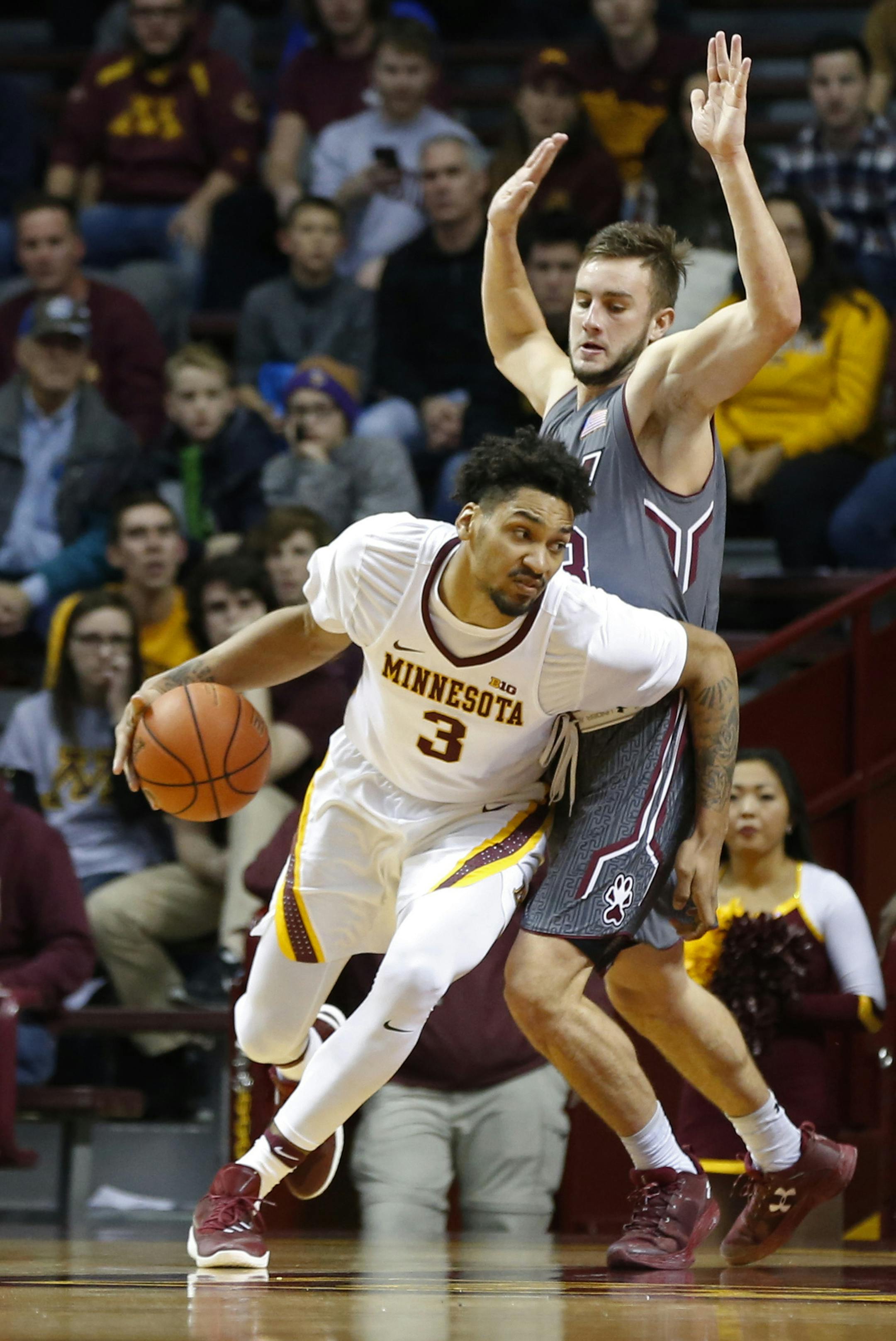 Minnesota's Jordan Murphy, left, drives around Southern Illinois' Sean O'Brien during the first half of an NCAA college basketball game Friday, Nov. 25, 2016, in Minneapolis. (AP Photo/Jim Mone)