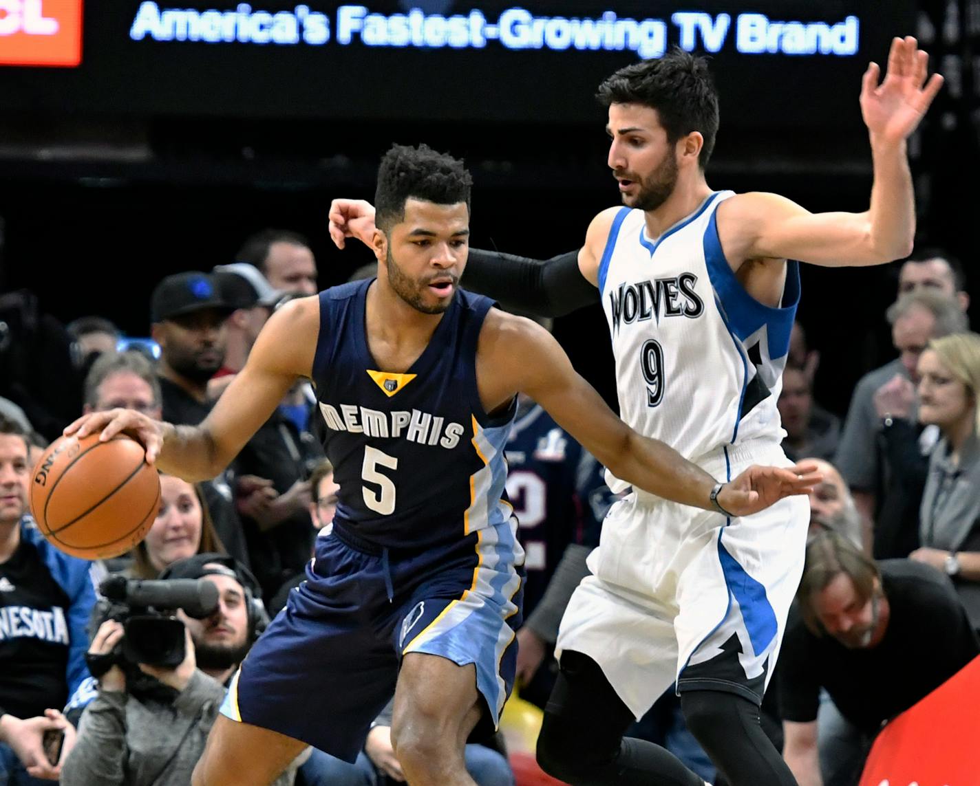 Memphis Grizzlies' Andrew Harrison, left, keeps the ball away from Minnesota Timberwolves' Ricky Rubio, of Spain, during the first quarter of an NBA basketball game Saturday, Feb. 4, 2017, in Minneapolis. (AP Photo/Jim Mone)