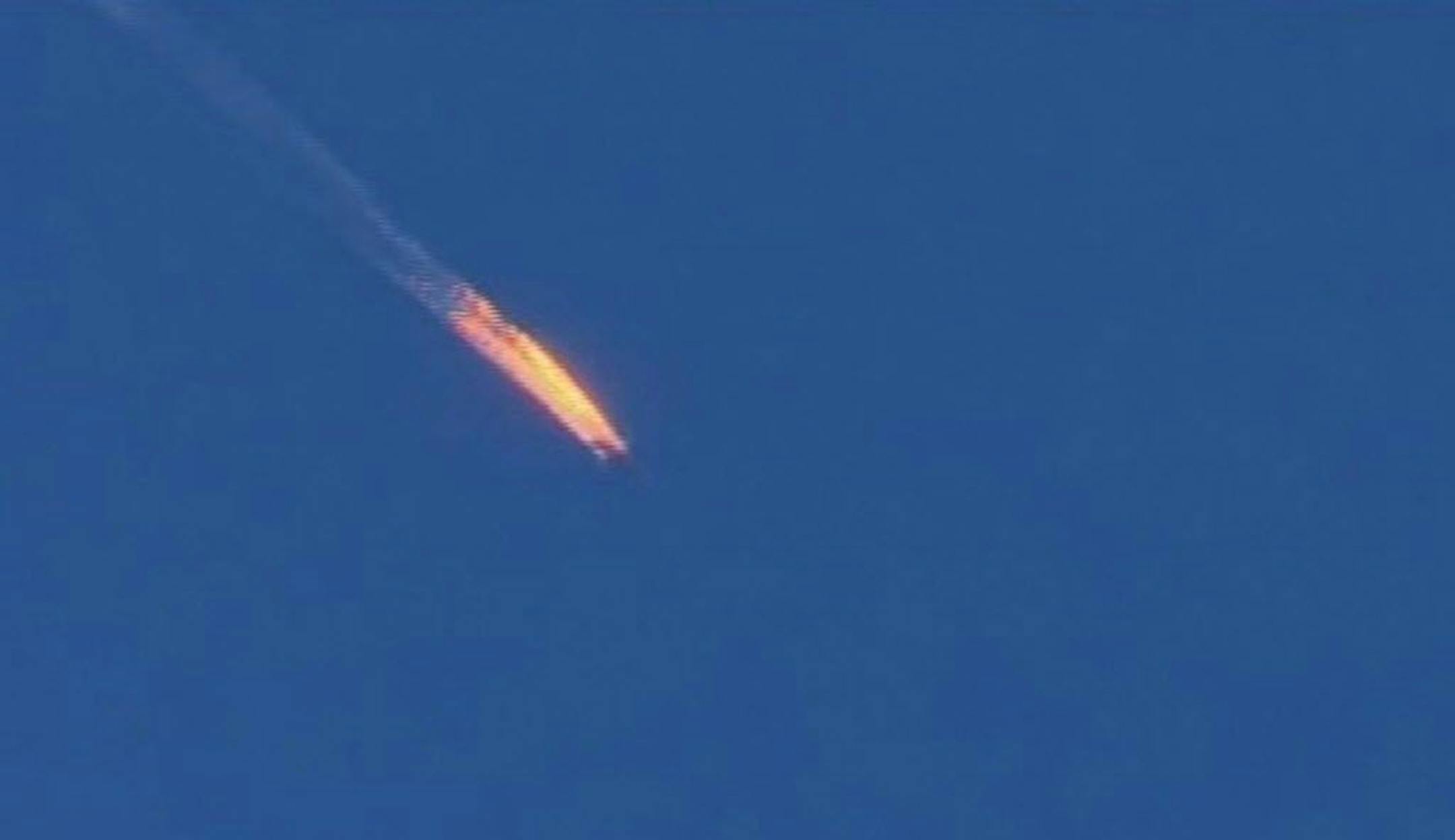 This frame grab from video by Haberturk TV, shows a Russian warplane on fire before crashing on a hill as seen from Hatay province, Turkey, Tuesday, Nov. 24, 2015. Turkey shot down the Russian warplane Tuesday, claiming it had violated Turkish airspace and ignored repeated warnings. Russia denied that the plane crossed the Syrian border into Turkish skies.