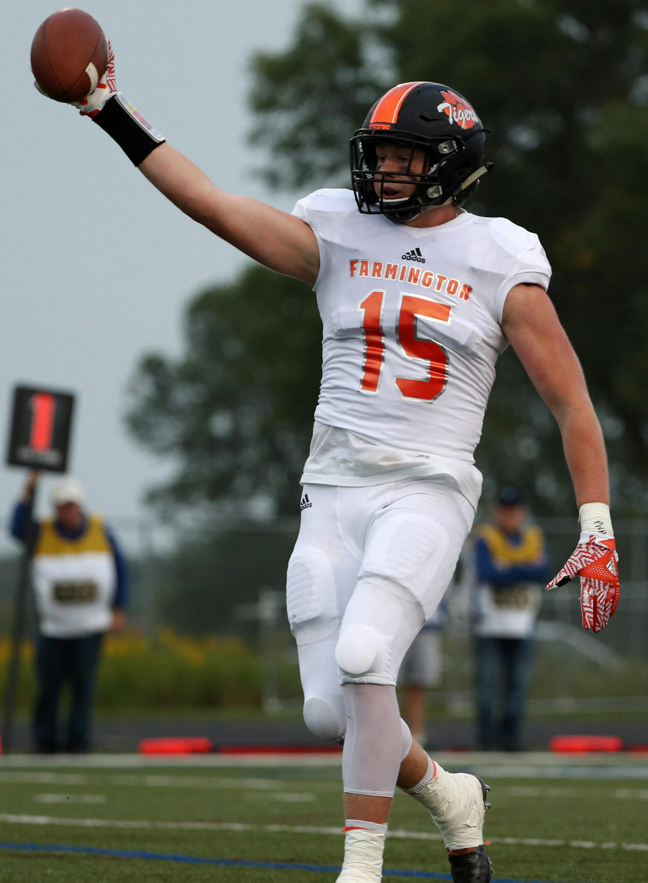Farmington High School linebacker Brock Mogensen (15) celebrated after running the ball in for a touchdown in the first half. ] ANTHONY SOUFFLE &#xef; anthony.souffle@startribune.com Game action from a Class 6A football game between Woodbury High School and Farmington High School Friday, Sept. 1, 2017 at Woodbury High School in Woodbury, Minn.