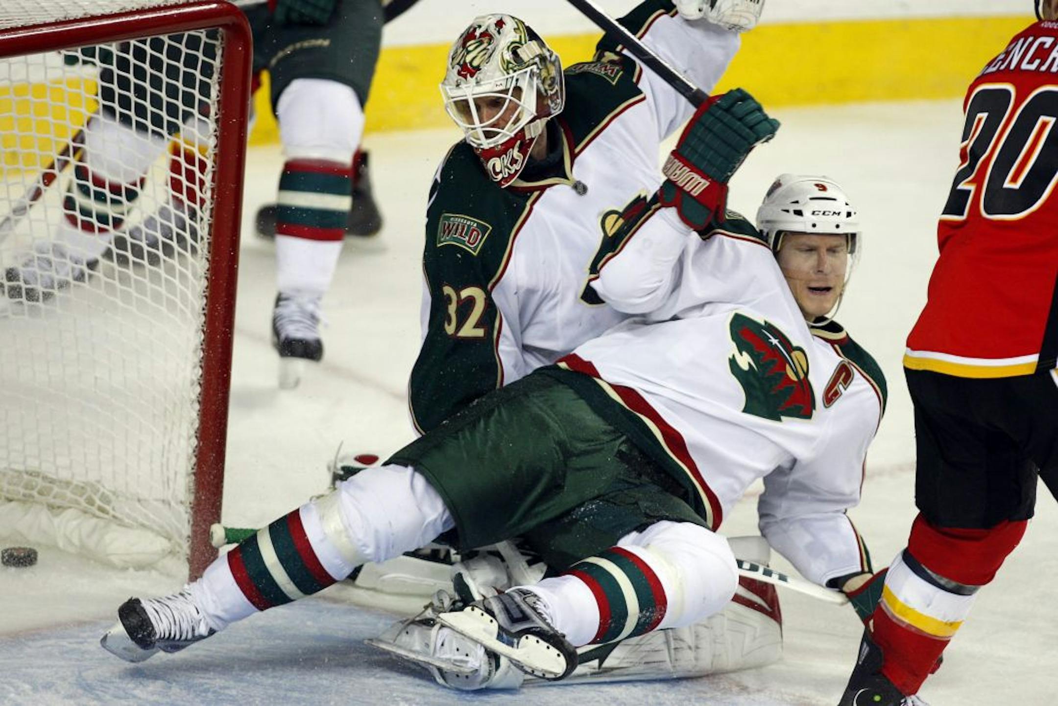 Wild goalie Niklas Backstrom looked back at the puck as center Mikko Koivu crashed into him and Calgary's Jarome Iginla scored his 500th career goal on Jan. 7.