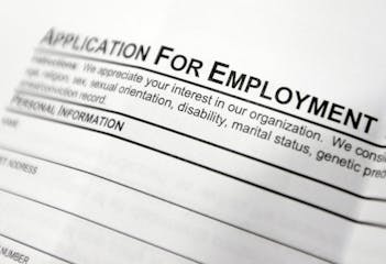 FILE - This April 22, 2014, file photo shows an employment application form on a table at a job fair in Hudson, N.Y. Middle-age white Americans with l