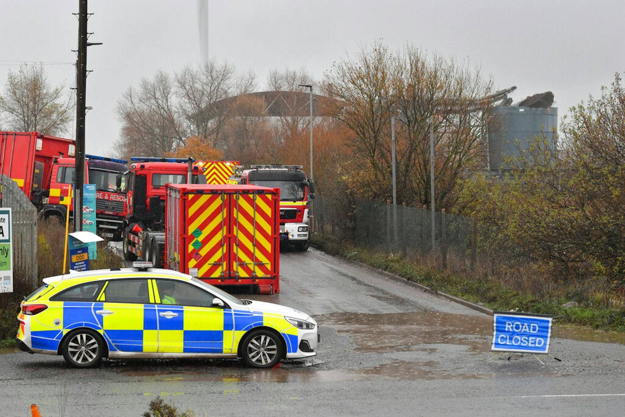 Emergency services attend to a large explosion at a warehouse in Bristol, England, Thursday Dec. 3, 2020.