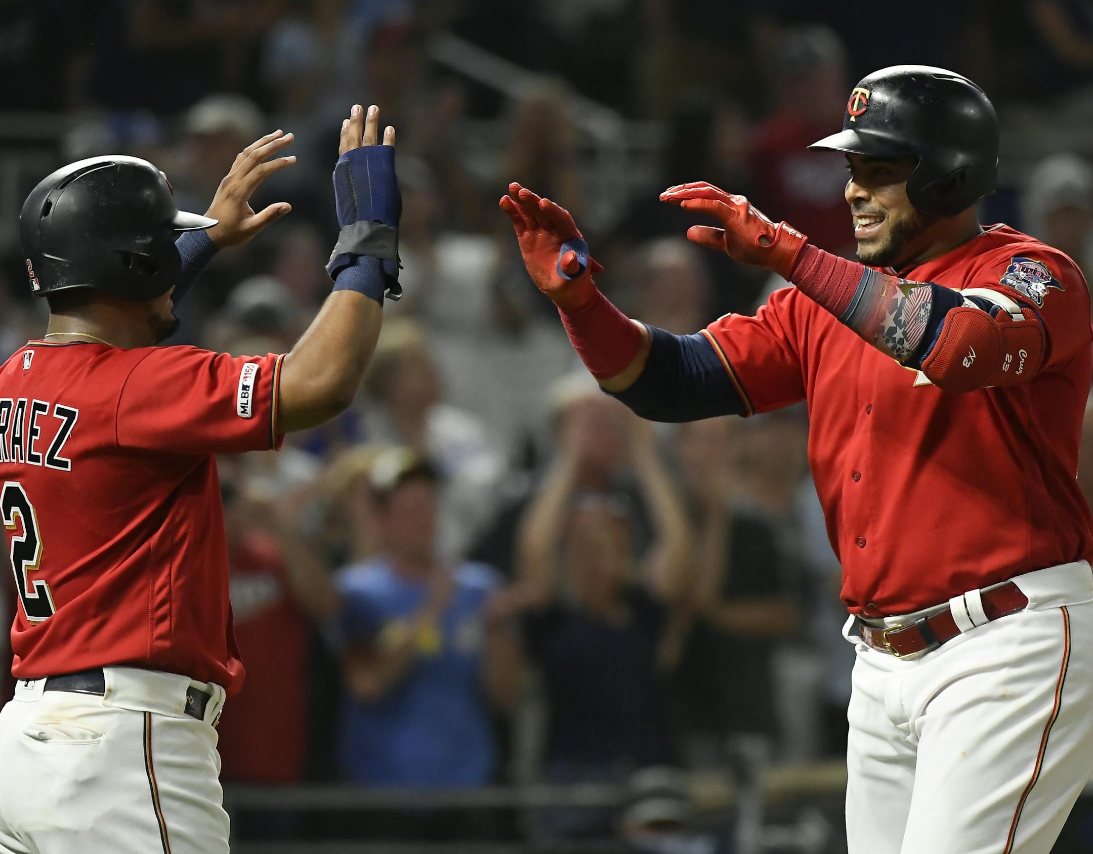Minnesota Twins second baseman Luis Arraez (2) and designated hitter Nelson Cruz (23) celebrated Cruz's third home run of the night against the Kansas City Royals. ] Aaron Lavinsky ¥ aaron.lavinsky@startribune.com The Minnesota Twins played the Kansas City Royals on Saturday, Aug. 3, 2019 at Target Field in Minneapolis, Minn. A pre-game ceremony was held for retired Twin Joe Nathan, who is being inducted into the Twins Hall of Fame.
