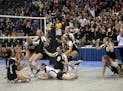 Belle Plaine rushes the court after winning the Class 2A Girls State Volleyball Championship in the third set Saturday at the Xcel Energy Center in Sa