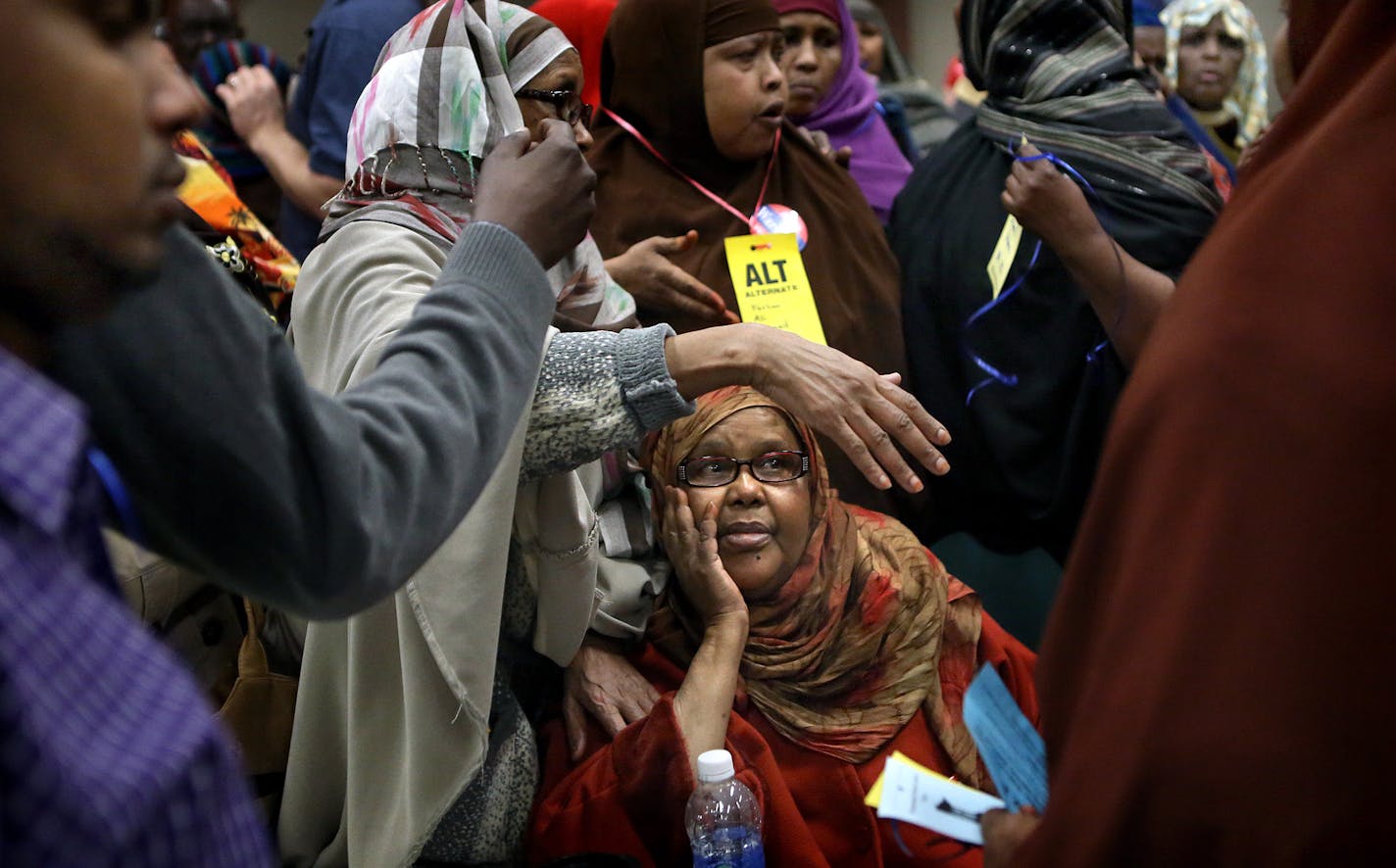 Women in Muslim dress waited in line during a process of upgrading alternates to delegates that became congested as names were being checked and verified. ] (JIM GEHRZ/STAR TRIBUNE) / April 27, 2013 / 12:00 PM Minneapolis, MN &#x201a;&#xc4;&#xec; BACKGROUND INFORMATIN- Minneapolis DFL delegates and alternates for Ward 6&#x201a;&#xc4;&#xf4;s City Council race gathered to select who they will endorse in the 2013 elections. Incumbent and council vice president Robert Lilligren surprisingly announce