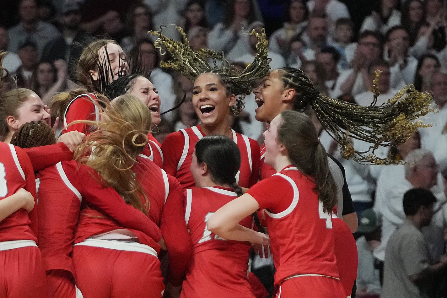 Benilde-St. Margaret's players celebrate their 66-60 win over Stewartville Saturday, March 18, 2023 during the second half of the Class 3A girls' basketball state championship at Williams Arena in Minneapolis, Minn. BSM beat Stewartville 66-60. ]