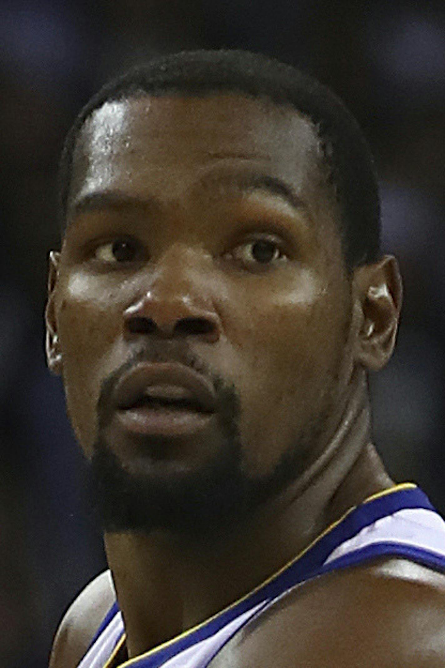 Golden State Warriors' Kevin Durant, right, looks to pass the ball away from Los Angeles Clippers' Tyrone Wallace (12) during the second half of an NBA basketball game Wednesday, Jan. 10, 2018, in Oakland, Calif. (AP Photo/Ben Margot)