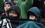 Philadelphia Eagles' fans huddle during the second half of an NFL football game against the Dallas Cowboys, Sunday, Dec. 31, 2017, in Philadelphia. (A