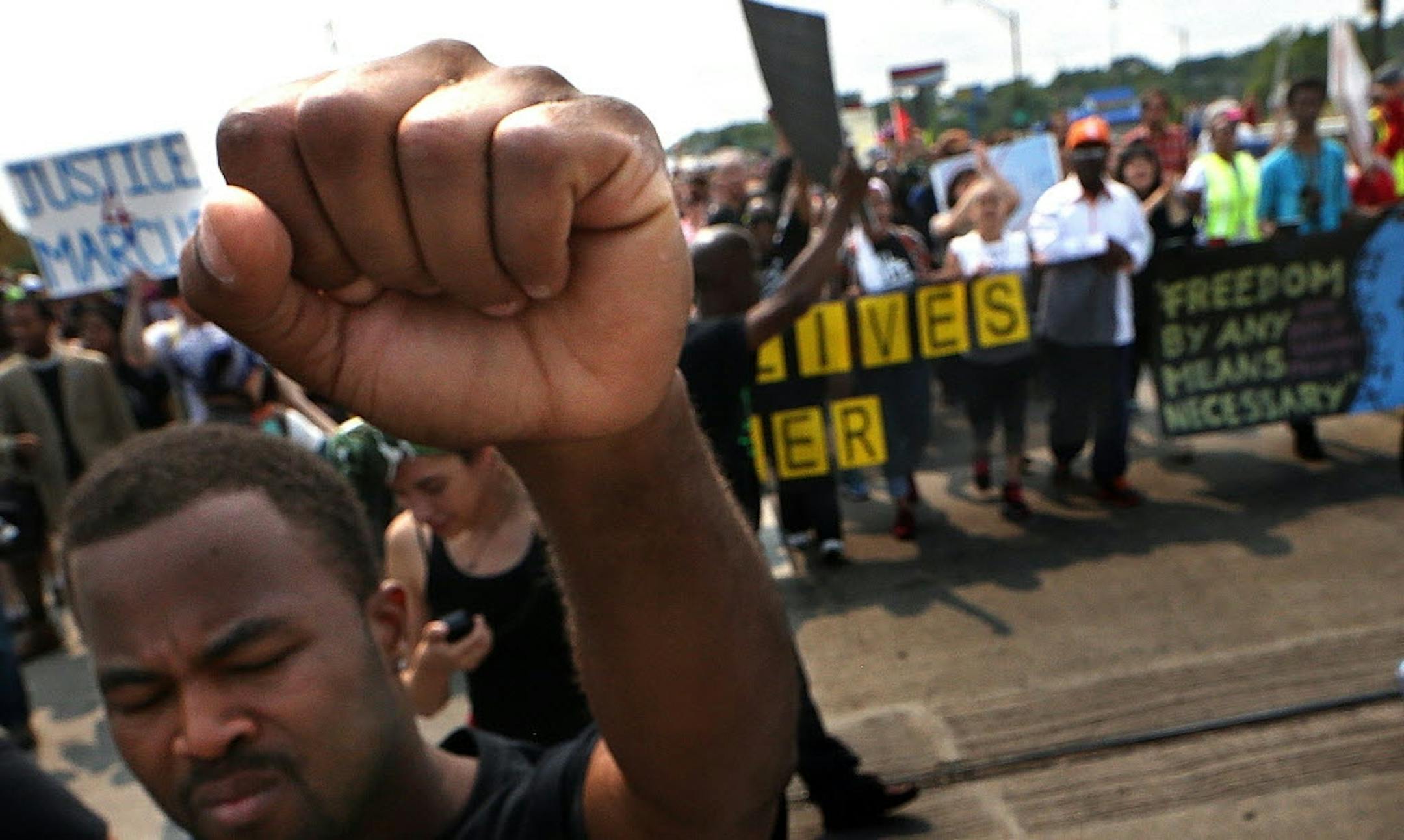Rashad Turner, lead organizer for Black Lives Matter St. Paul, lead the group down Snelling Ave., toward the State Fair Grounds.