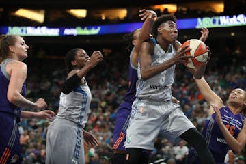 Minnesota Lynx forward Natasha Howard (3) scored over Phoenix Mercury forward Emma Cannon (10), and guard Alexis Prince (15) in the second half at Xce