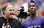 TCU head football coach Gary Patterson, left, and quarterback Trevone Boykin, right, talk on the field before Boykin threw out the ceremonial first pi