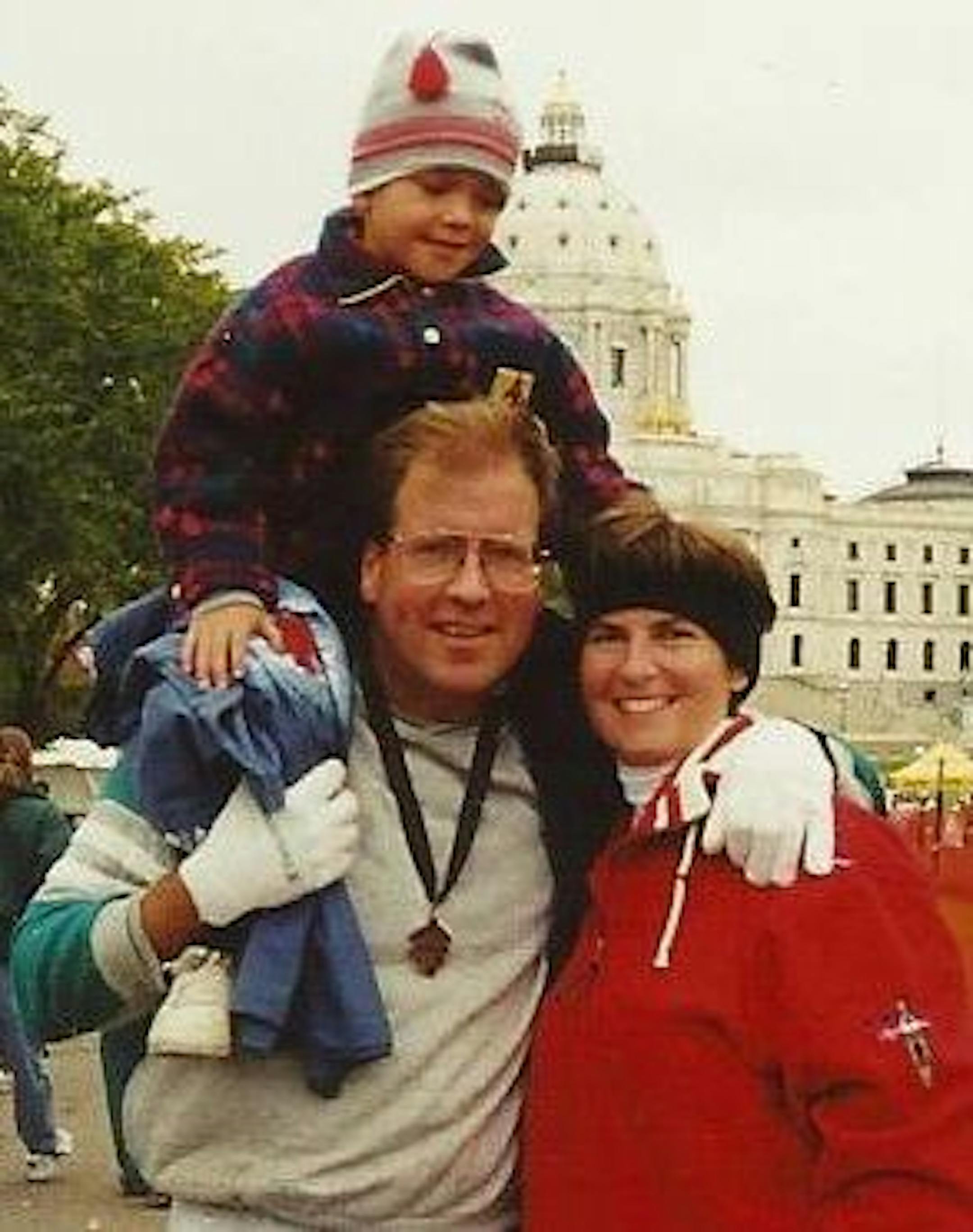 Tom Jackson with wife Julie and son Joe after his first Twin Cities Marathon in 1998.