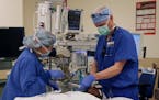 Dr. Brian Chesebro, right, in Portland, Ore., has calculated that by simply using the anesthesia gas sevoflurane in most surgeries, instead of the sim