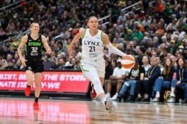 Lynx guard Kayla McBride dribbles up the court against Seattle on May 14 at Target Center.