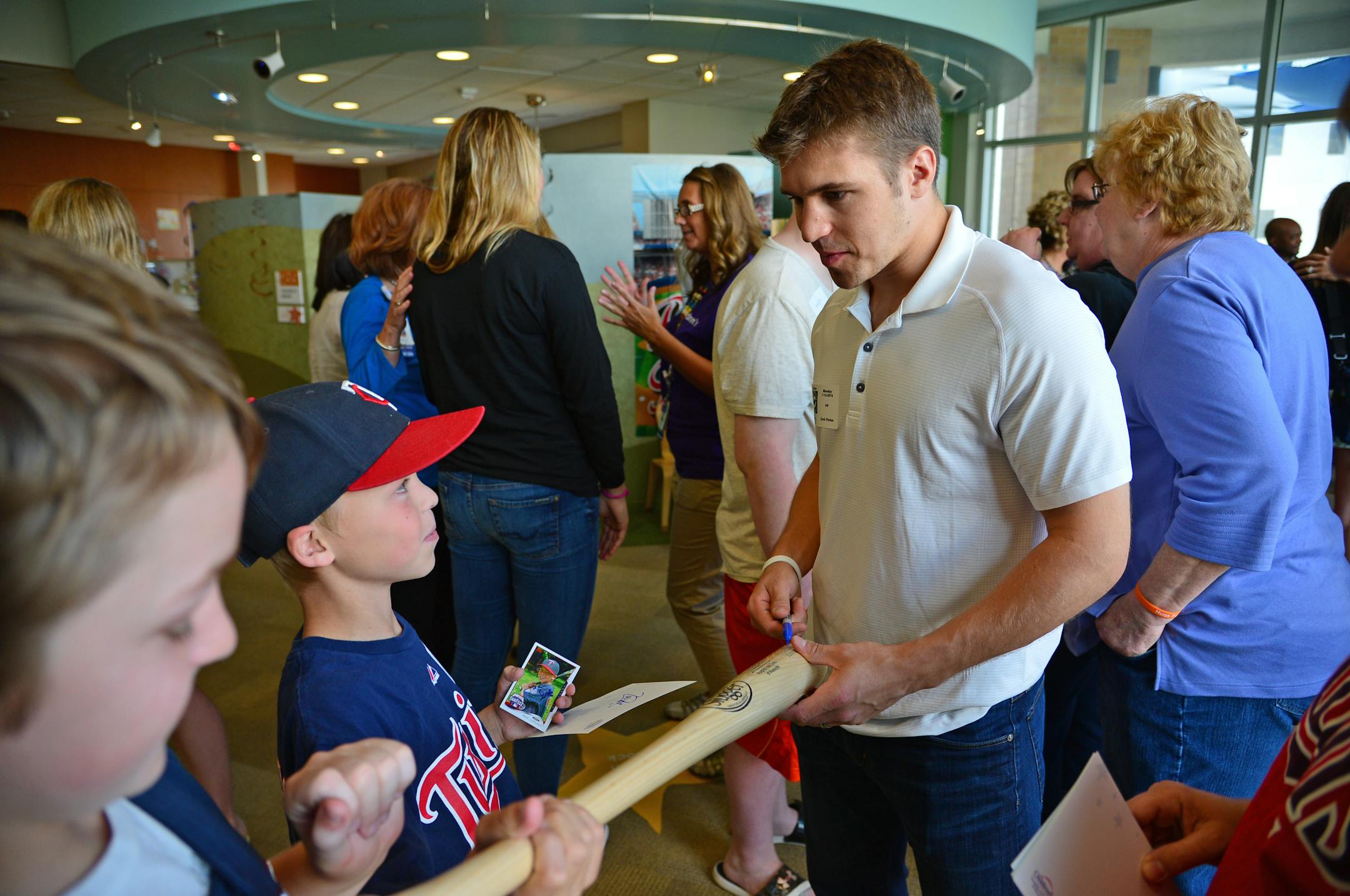 Wild forward Zach Parise, shown signing a bat for Eric Carlson, 10, of Chanhassen during an MLB All-Star event at Children's Hospital, answered the #IceBucketChallenge, which raises money to battle Amyotrophic Lateral Sclerosis (ALS), also known as Lou Gehrig's disease.