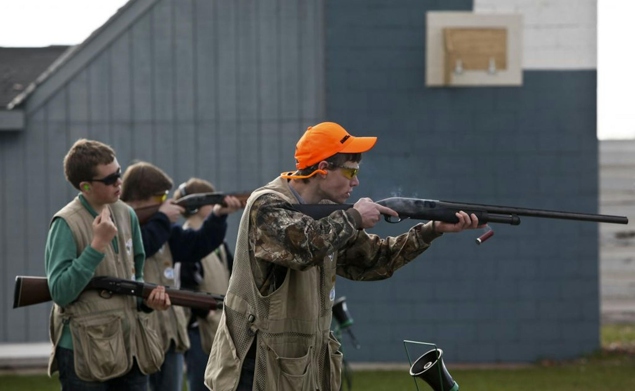 Eric Hagelee, an Edina 10th-grader, fired his shotgun at a clay target during a shoot last week at the Minneapolis Gun Club. Waiting his turn, behind, is Andrew Brandt, a ninth-grader.
