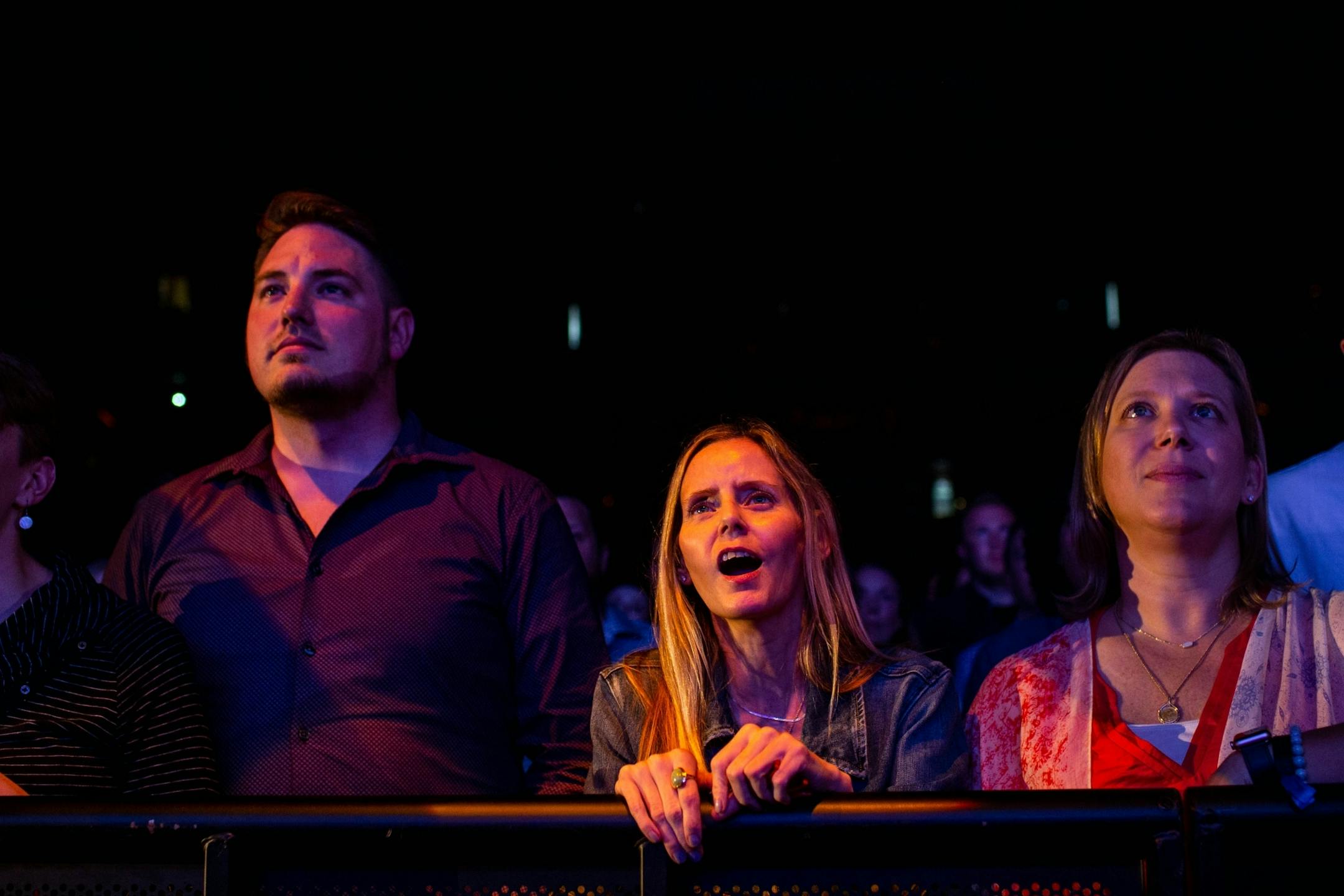 An audience member sings along as John Mayer performs at Xcel Energy Center Monday, August 5, 2019.