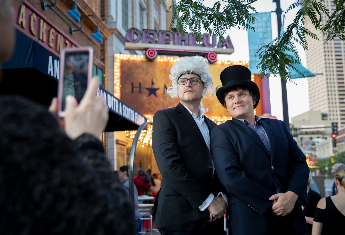 Benjamin Rosas, of Stillwater, dressed as George Washington and his brother Drew Rosas, of Los Angeles, dressed as John Quincy Adams, got their picture taken by their mom Maren Rosas, of Stillwater in front of the Marquee as arrived at opening night of Hamilton at the Orpheum Theatre in Minneapolis, Minn., on August 29, 2018. ] RENEE JONES SCHNEIDER ¥ renee.jones@startribune.com