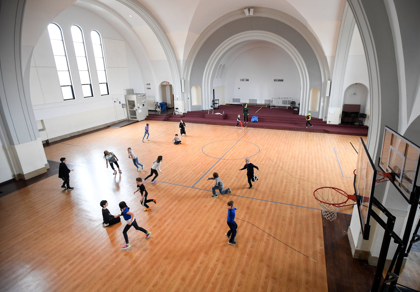 Twin Cities German Immersion School students played in the former Catholic church turned gymnasium Tuesday. ] AARON LAVINSKY &#xef; aaron.lavinsky@startribune.com Neighborhood angst is brewing in Como Park, as the Twin Cities German Immersion School considers tearing down a former Catholic church it owns and has used as a gym and cafeteria to make room for expansion. Neighbors are not happy and want the school to find a way to preserve the former St. Andrew's Catholic Church, built in 1927. We p