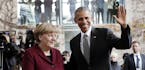 U.S. President Barack Obama is welcomed by German Chancellor Angela Merkel prior to a meeting of the government heads of Germany, France, Italy, Spain
