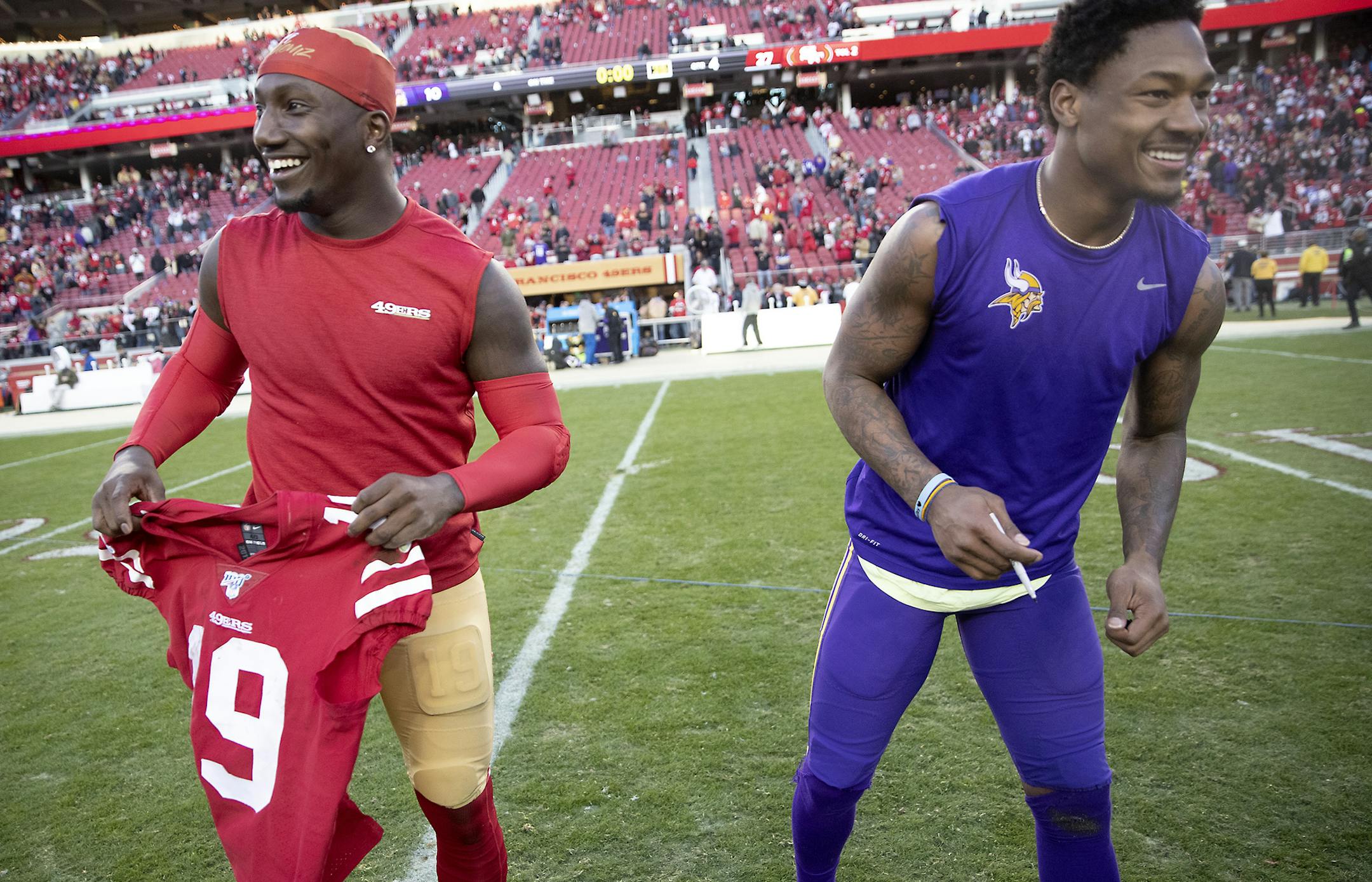 San Francisco 49ers wide receiver Deebo Samuel, left, and Minnesota Vikings wide receiver Stefon Diggs were all smiles as they exchanged jerseys after San Francisco defeated the Minnesota Vikings 27-10. ] ELIZABETH FLORES • liz.flores@startribune.com The Minnesota Vikings take on the San Francisco 49ers in a playoff game at Levi's Stadium, Saturday, January 11, 2020 in Santa Clara, CA.