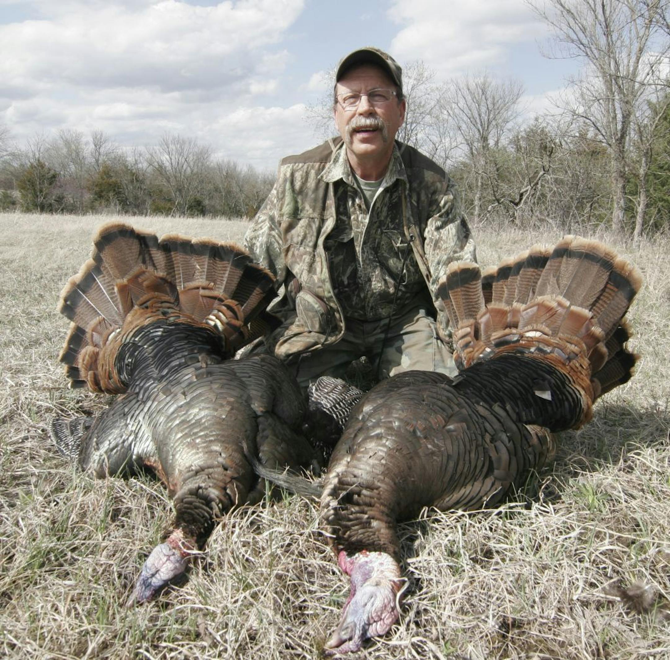 Doug Smith/Star Tribune; April 21, 2013, Auburn, Ks. Tom Kalahar of Olivia, Minn., bagged these two gobblers one morning this week in Kansas. The bag limit in Kansas is two turkeys.