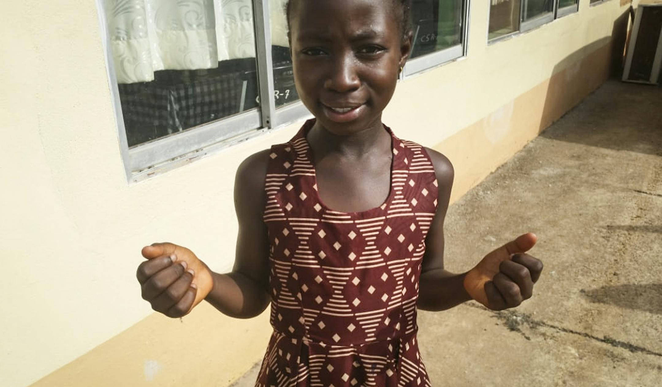 In this photo taken Thursday, Feb. 20, 2020, Joselia Kollie, who is the daughter of a popular gospel singer, explains how she desires to spread developmental messages through music with a song reminding Liberians of how much the country already has been through, in Gbarnga, Liberia. Liberian radio stations are getting the word out about how to prevent coronavirus, and one tune here is especially gaining praise: The person singing it is only 9 years old. (AP Photo/Jonathan Paye-Layleh)