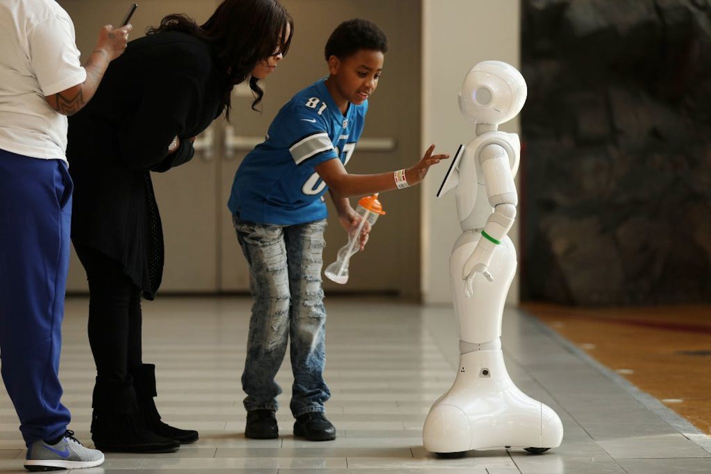 Jaleel Sykes, 12, of Detroit interacted with a Pepper humanoid robot in the Mall of America's rotunda Wednesday afternoon.