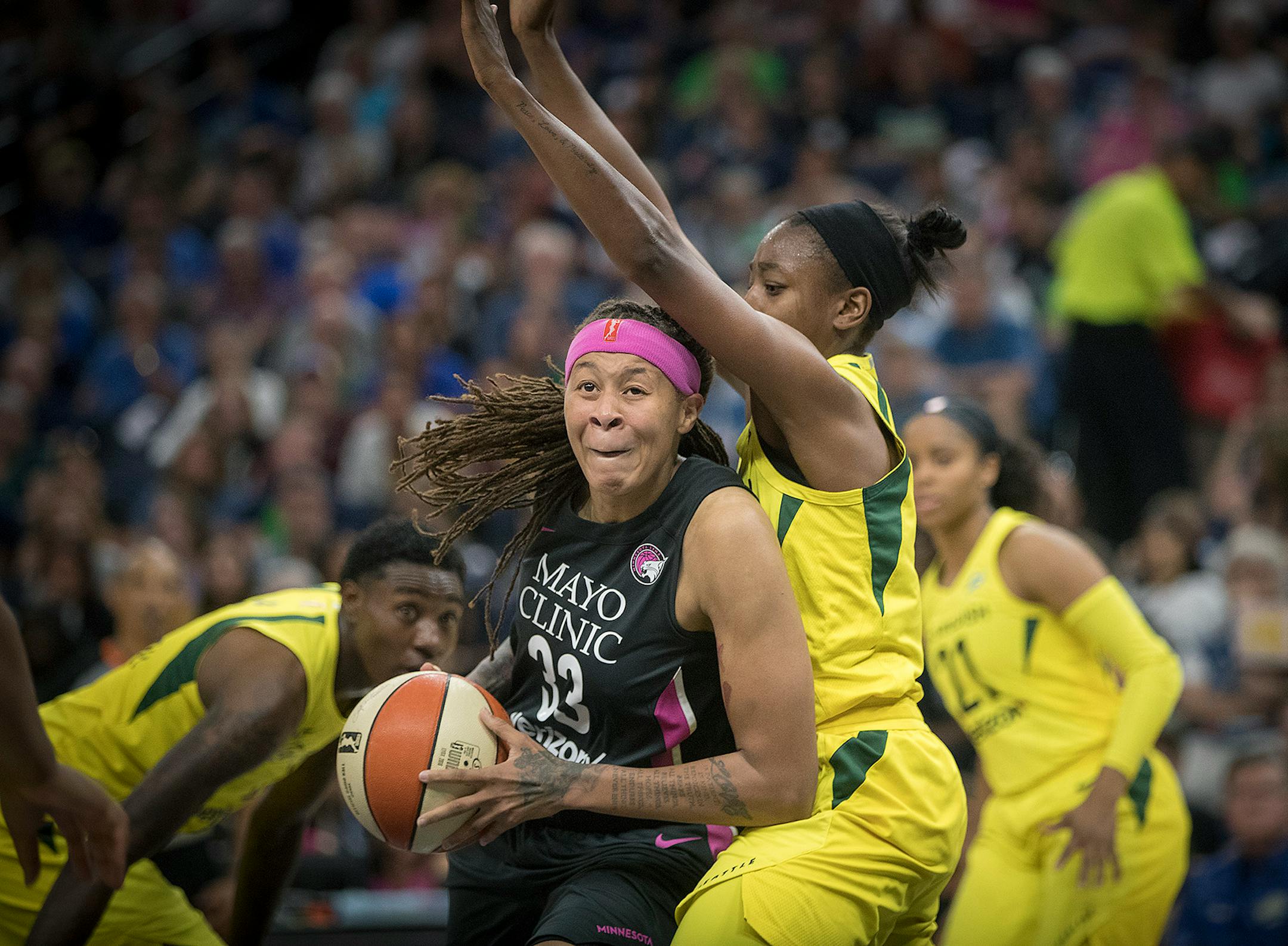 Lynx guard Seimone Augustus drove by Seattle Storm guard Jewell Loyd during the third quarter Sunday night.