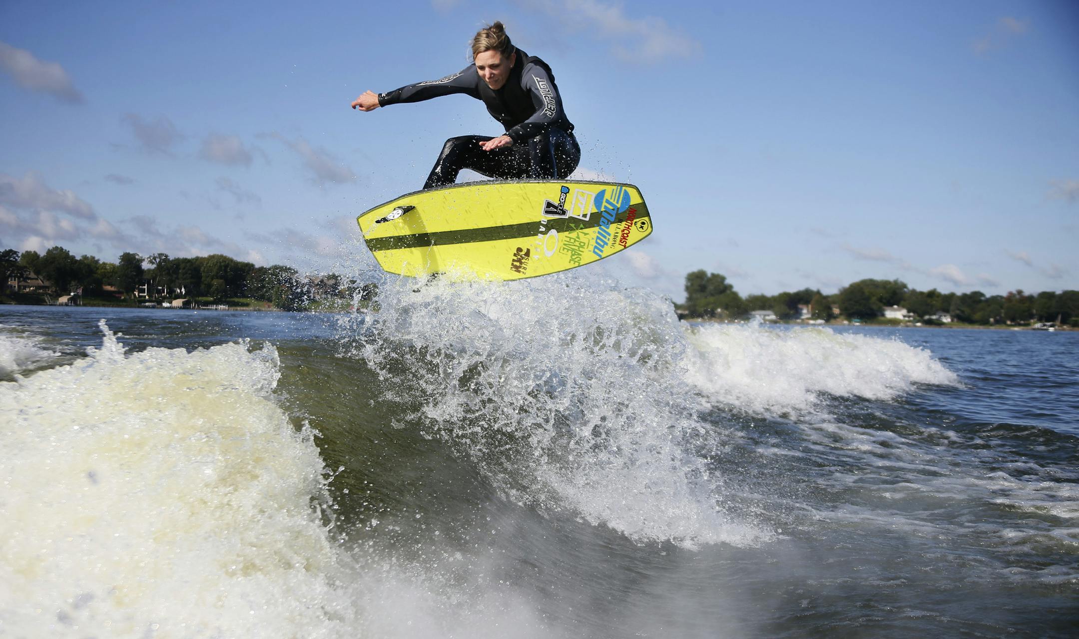 Stacia Bank, the current number one-ranked pro woman wake surfer practiced on Lake Minnetonka Monday September 15 , 2014 in Wayzata ,MN. Ten local wake surfers will compete Sept. 26-27 in a world competition. ] Jerry Holt Jerry.holt@startribune.com