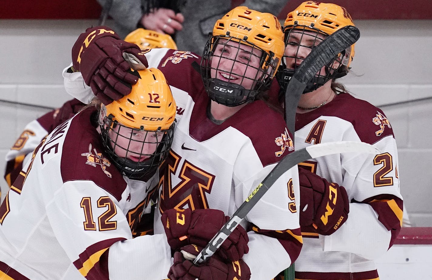 Gophers forward Grace Zumwinkle (12) got a hug from teammates during a home game earlier this season.