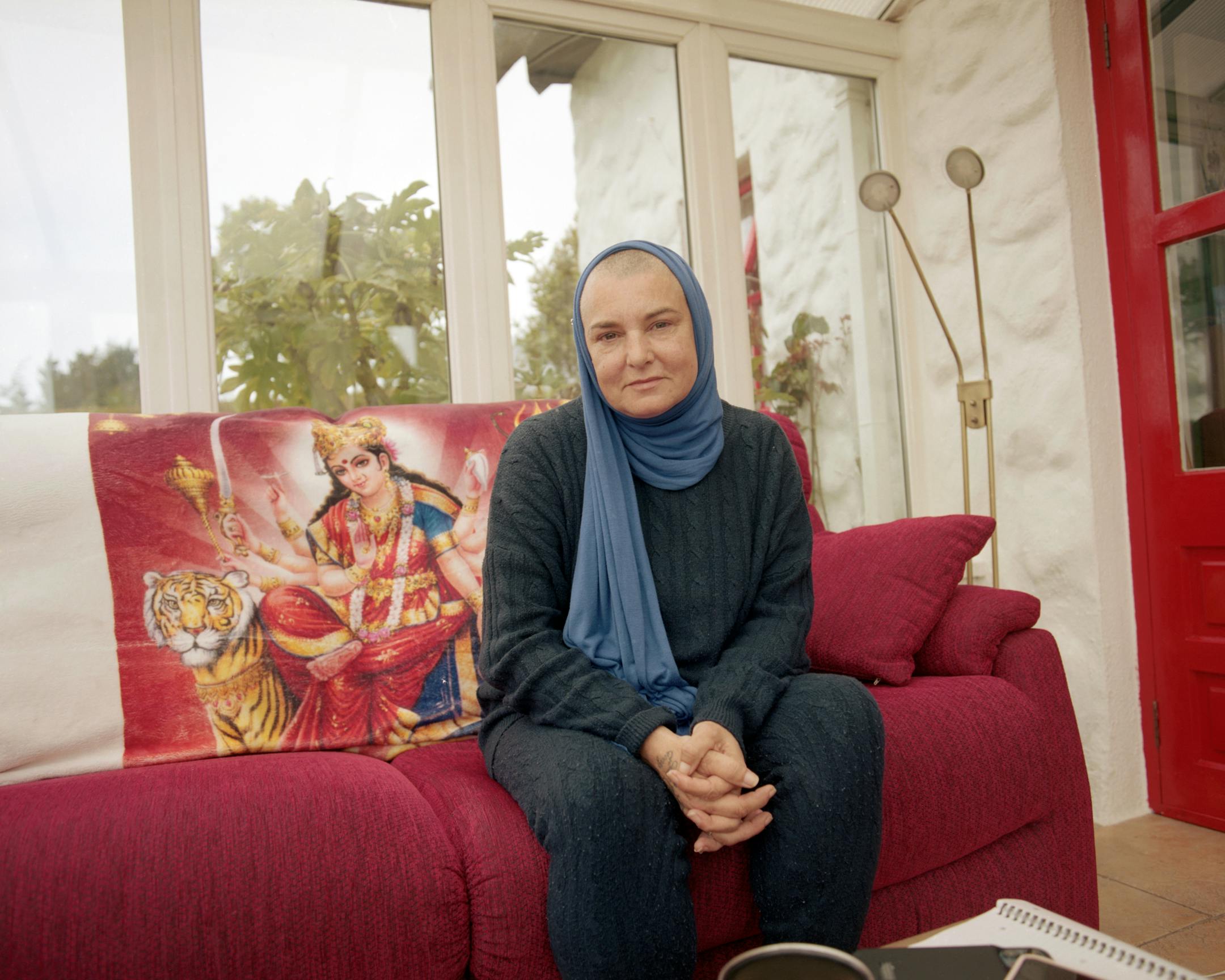 Sinead O'Connor at her home in Wicklow, Ireland, on May 10, 2021. O'Connor's memoir, "Rememberings," recasts the story of her career from her perspective. (Ellius Grace/The New York Times)