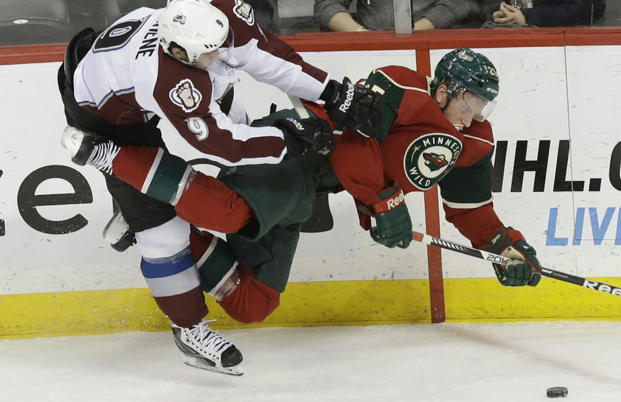 The Wild's Jonas Brodin and Colorado Avalanche's Matt Duchene collide in the first period.